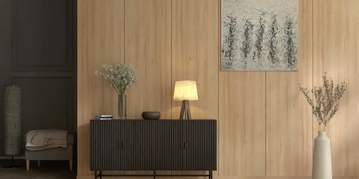 A hallway with a wall in Grandson Oak panels and a black chest of drawers