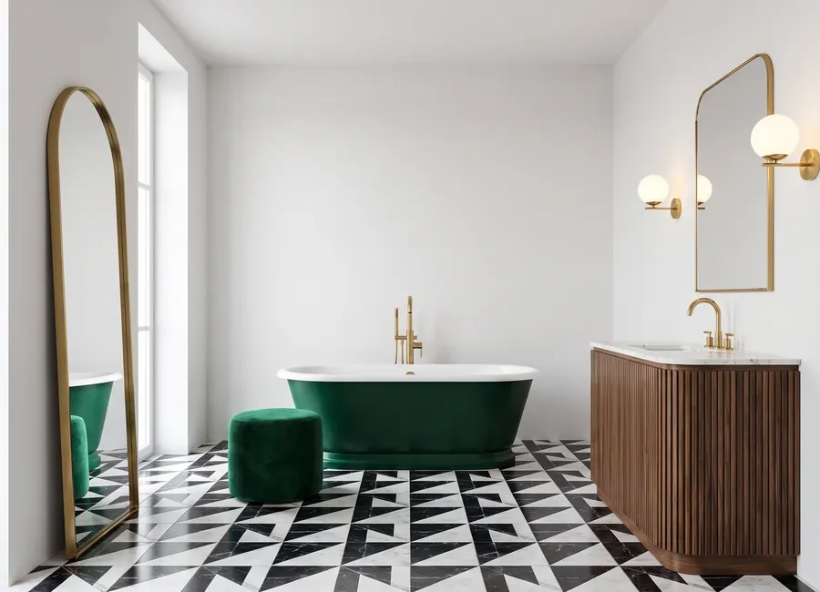 Art deco bathroom: an emerald bath with a brass tap, a geometric floor and a fluted walnut vanity, walls in panels in the Snow White C finish